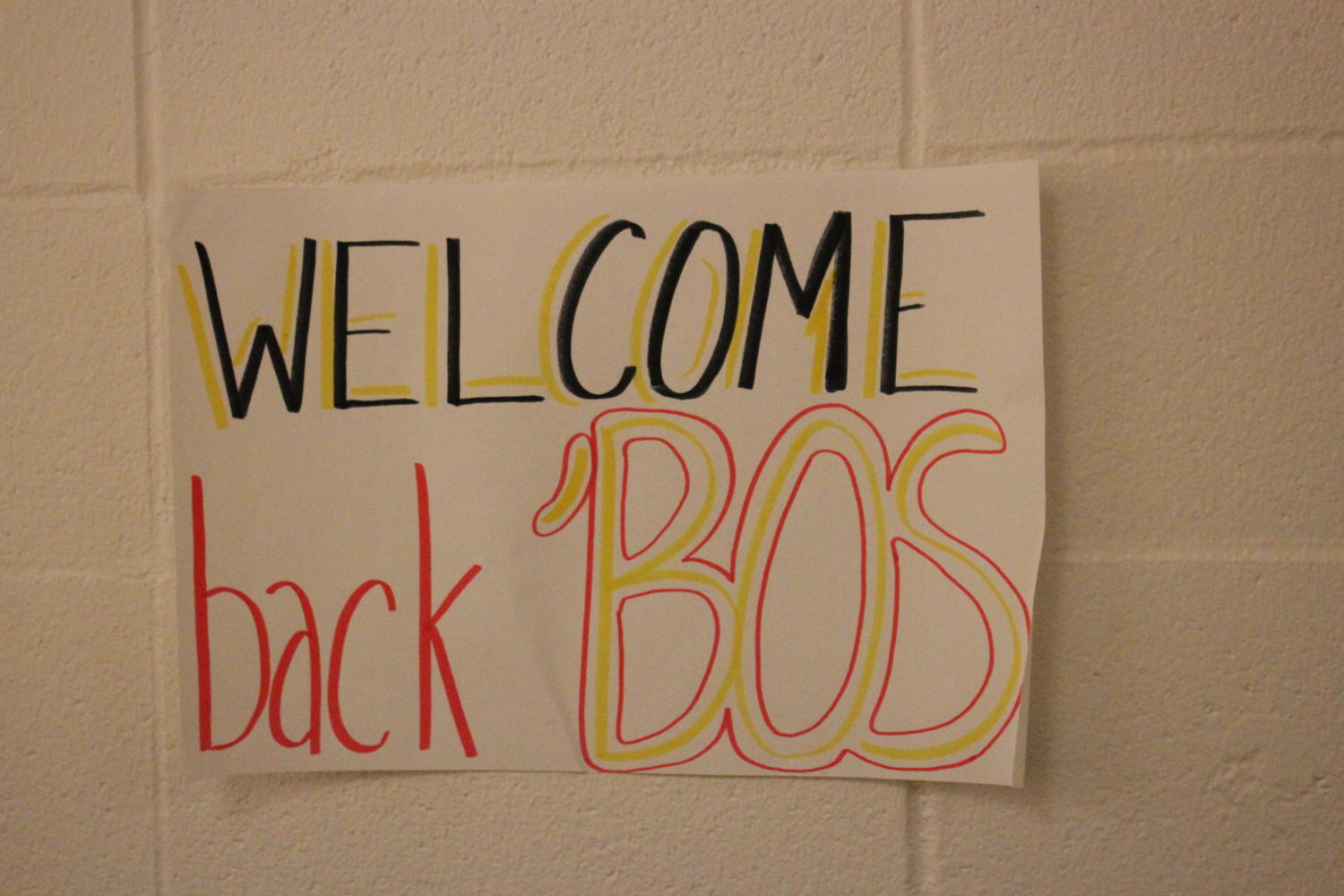  Welcome back Bos sign in hallway.