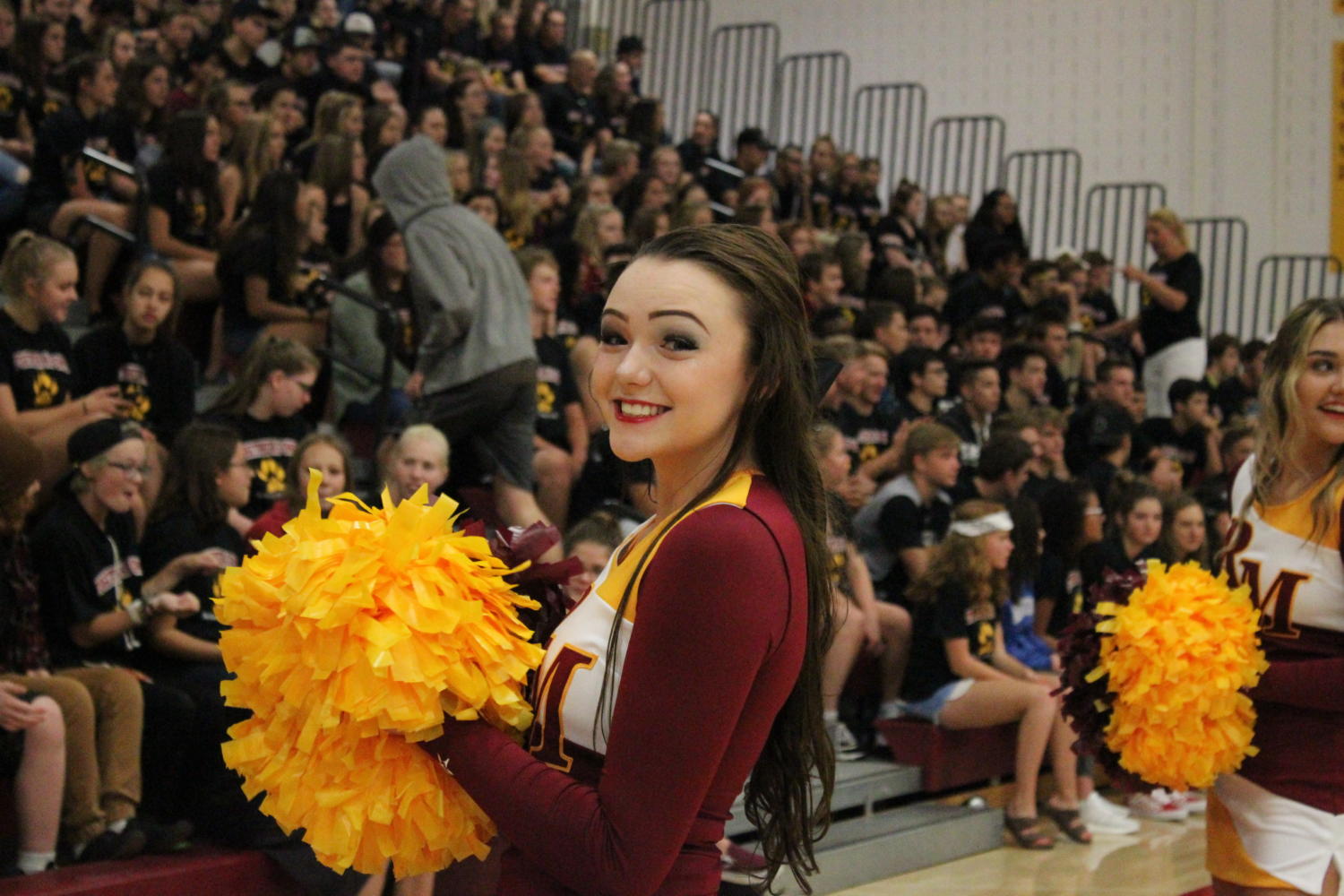 Ebby Cole, cheerleader at the back to school assembly.