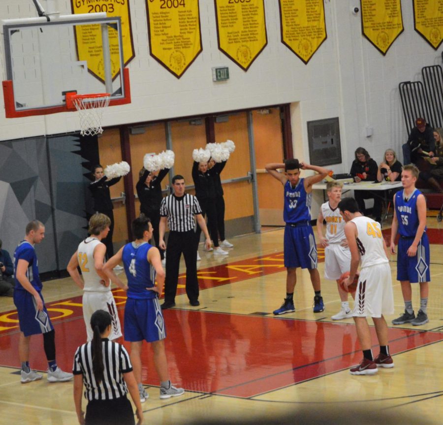 Senior Noah Lovell lines up for a free throw after being fouled.