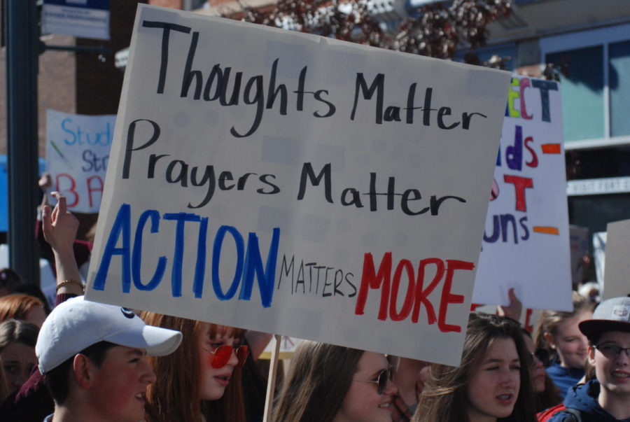 Students demand action in Old Town square on Tuesday afternoon