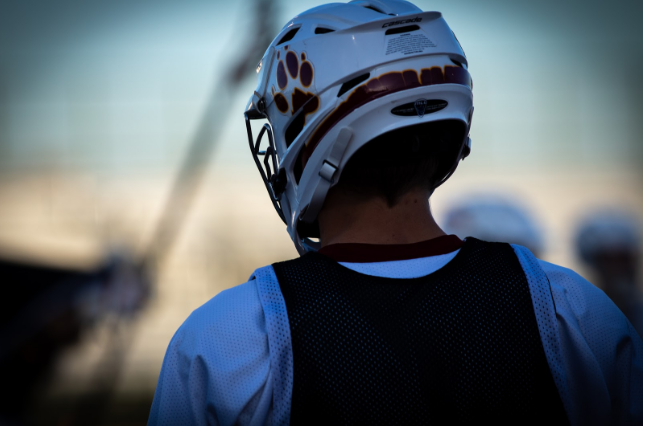A lobo lacrosse player at the senior game on April 25, 2018