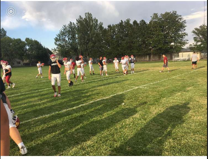 The Offense switches players for a new drive, as Nate Kendall walks to the sideline.

