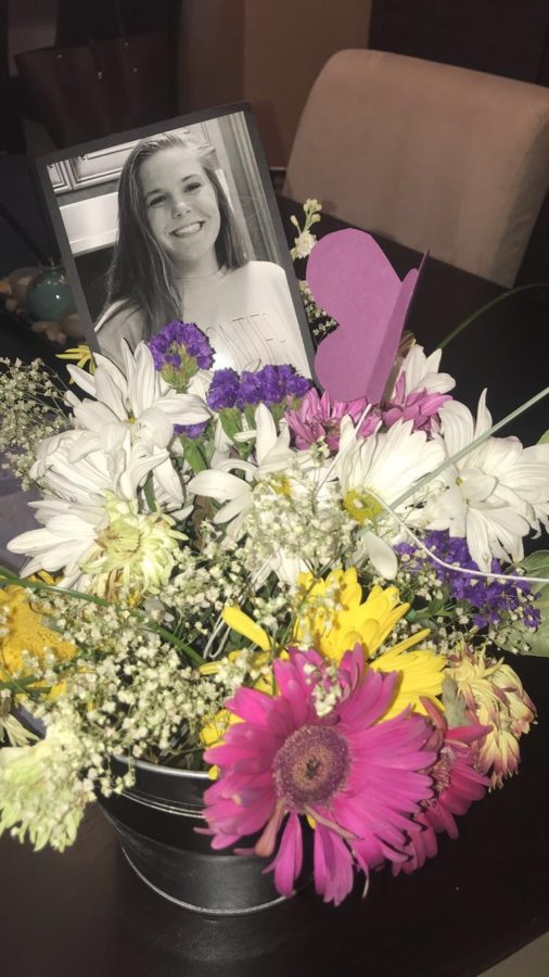 Flowers with pictures of Kate Prewett were placed around the church at her service on August 27th. 