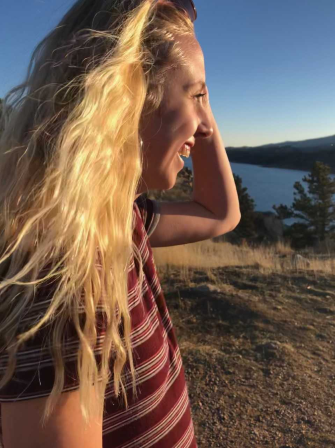 Kylie Harpman smiles into the sunshine at Horsetooth reservoir.