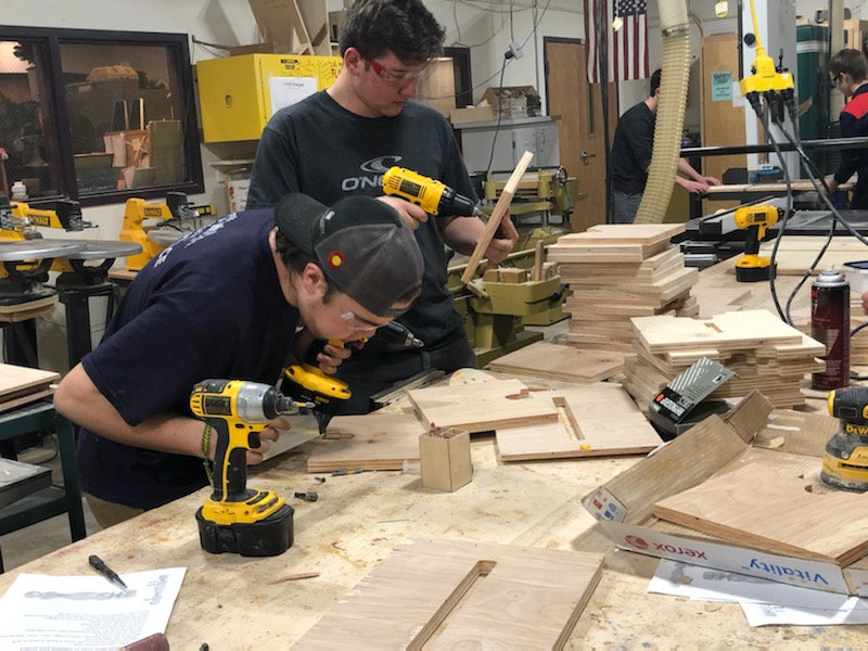 Woods students work on making their step stools. 