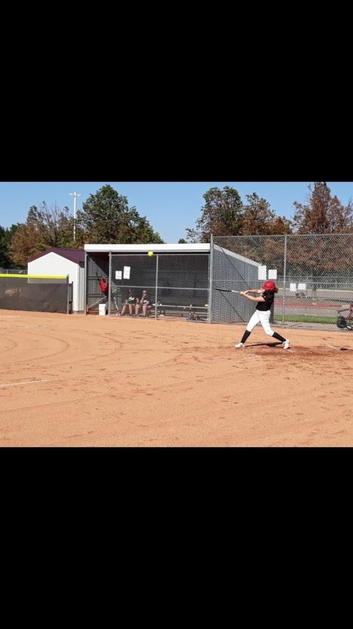 Shay Salazar, RMHS starting varsity first baseman hits to deep left field for a double.