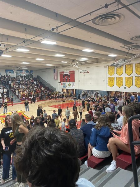Students flood into the gym for the back-to-school assembly.