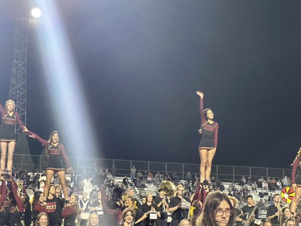 The Rocky cheer team raises school spirit during their routine. 