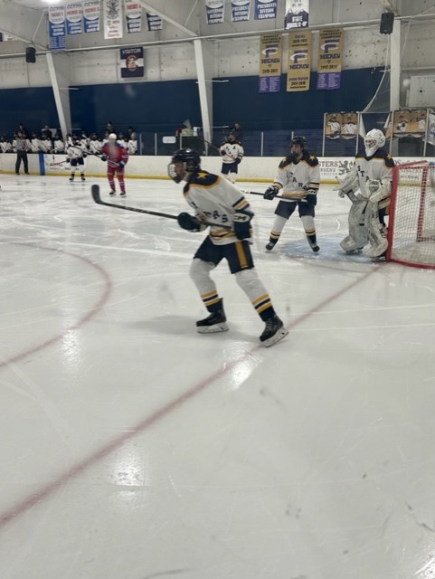 Stars players are in action on the ice during the game against Cherry Creek.