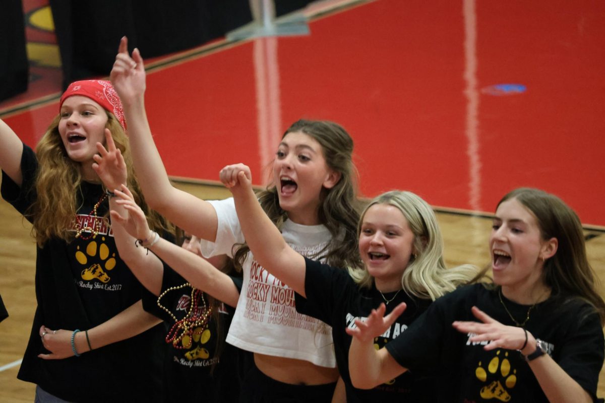 Students cheer for each other at the Back to School assembly. 