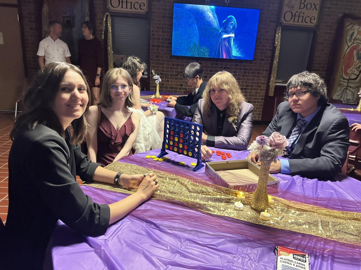 Students play board games at the Hoco Dance