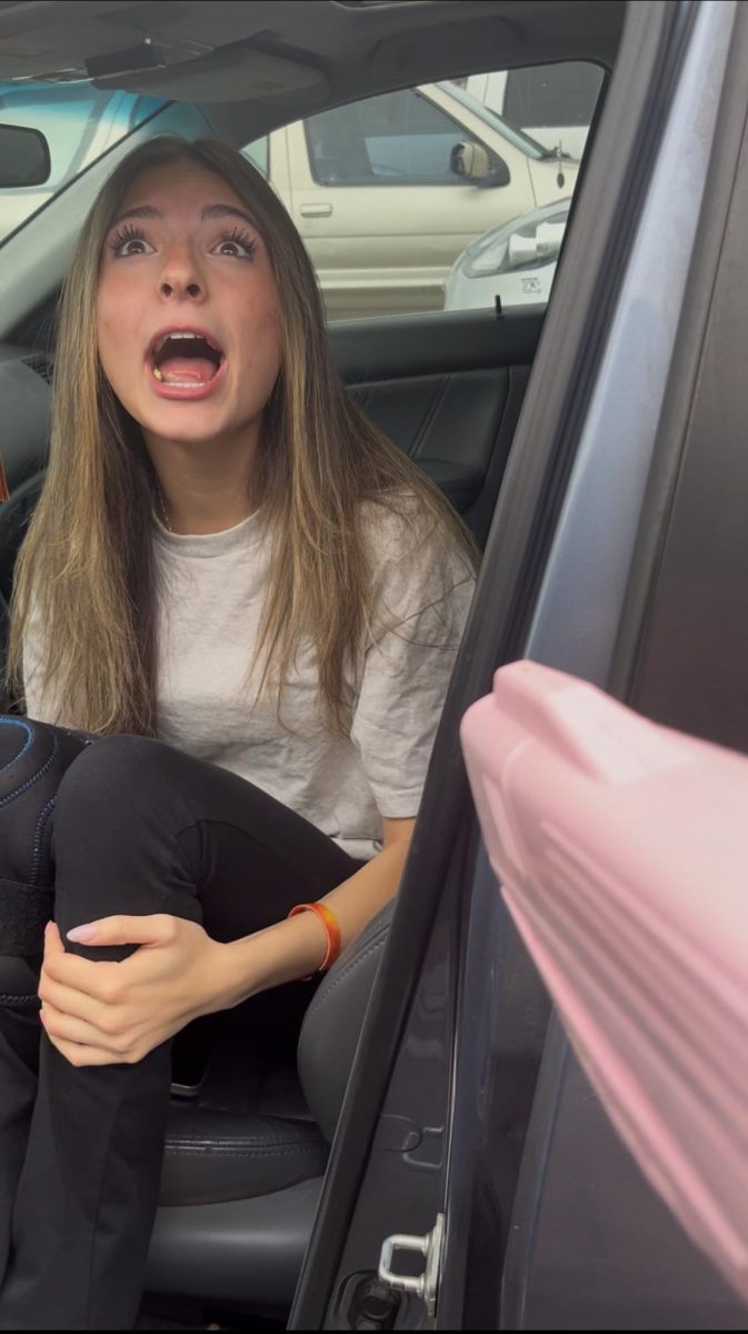 Senior Aliyah Maestas-Blue reacts as she gets eliminated in the Foothills Mall parking lot. 