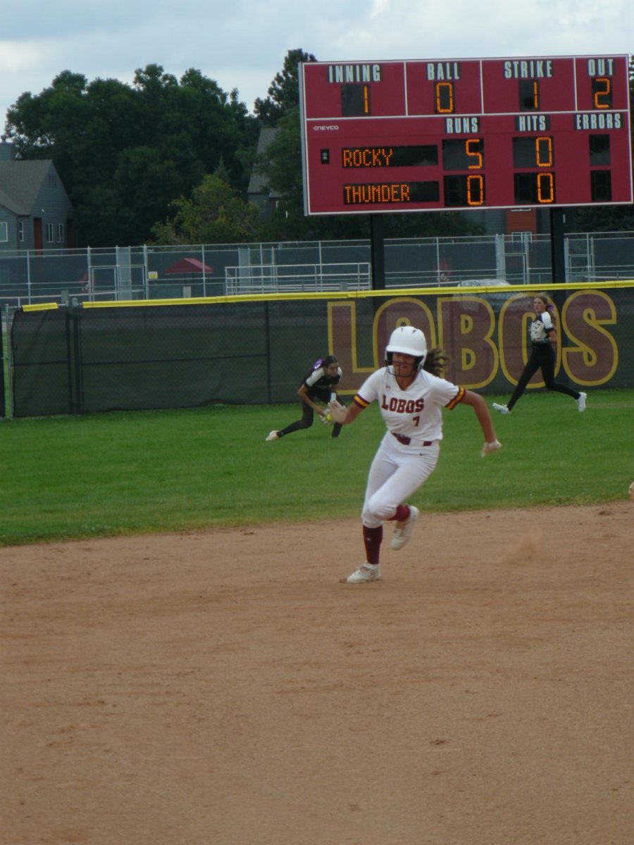 Varsity player Nevaeh Winfrey (junior) runs the bases after hitting a triple against Thunder Ridge. 