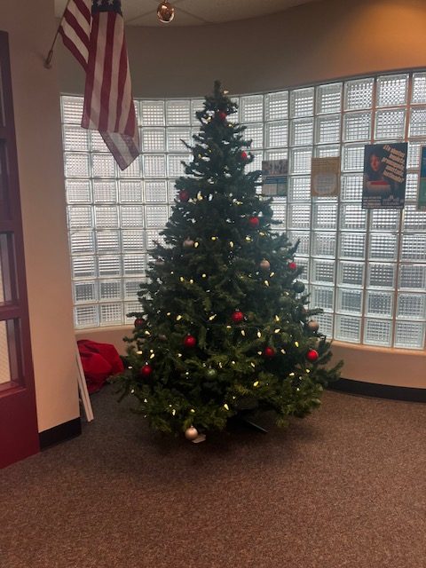 A Christmas tree decorates the Student Services office to celebrate the season. 