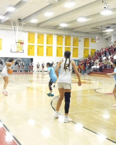 Rocky’s band kicks off the girls' varsity basketball game as Lobos take on Greeley West.