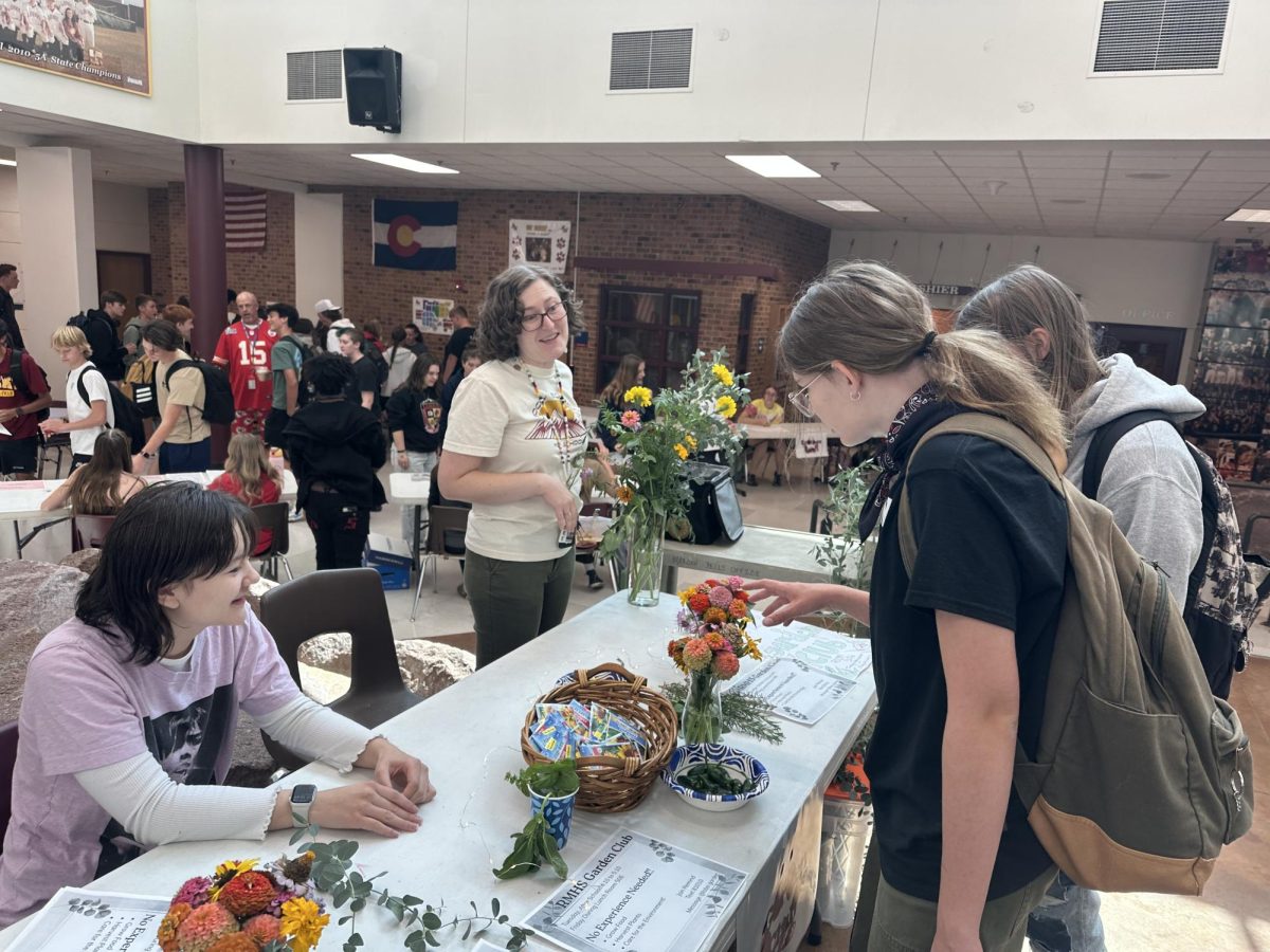Students look at the Garden Club Club Rush table as they take in their options for school involvement. Rocky had so many clubs for students to join. 