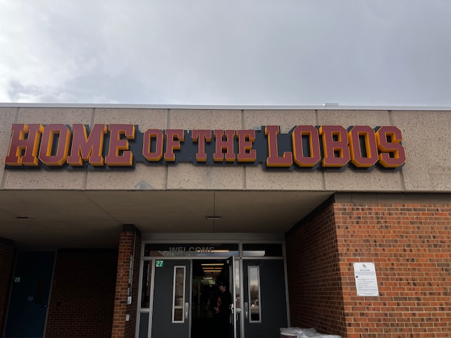 The Home of the Lobos sign provides a visual of Rocky's school spirit. 