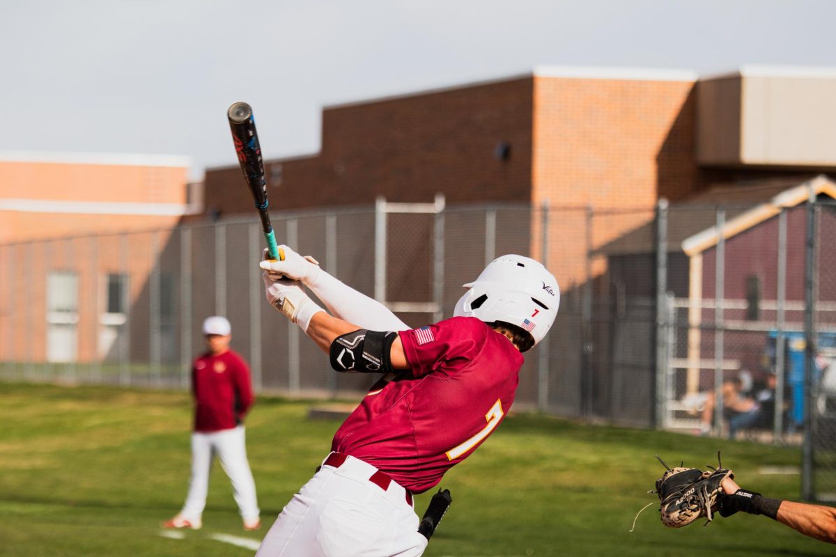 Senior Champ Rivera gets a hit against Poudre on April 7.