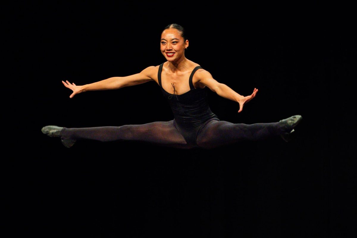 Sophia Imark leaps across the stage for the talent part of the program.