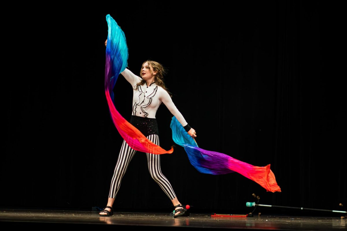 Kyle Eger shows off her circus performing skills for the talent portion of the night. 