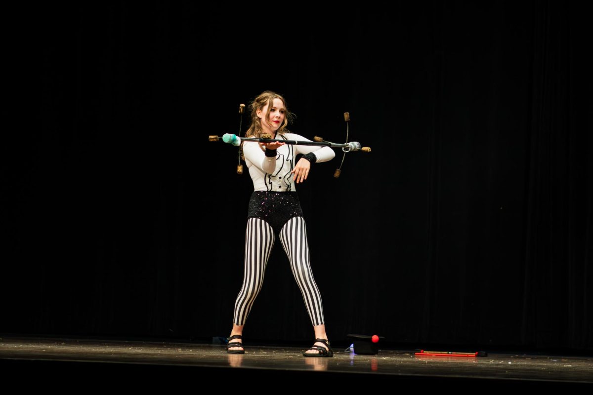 Kyle Eger shows off her circus performing skills for the talent portion of the night. 