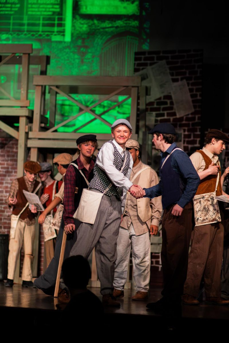 Freshman True Parks shakes after a deal to get better wages for the "newsies."
