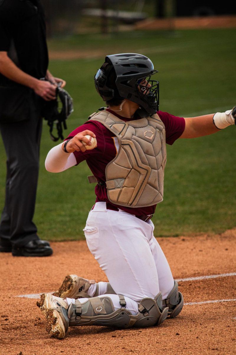 Senior Kaden Bauder-Tolar prepares to throw someone out.