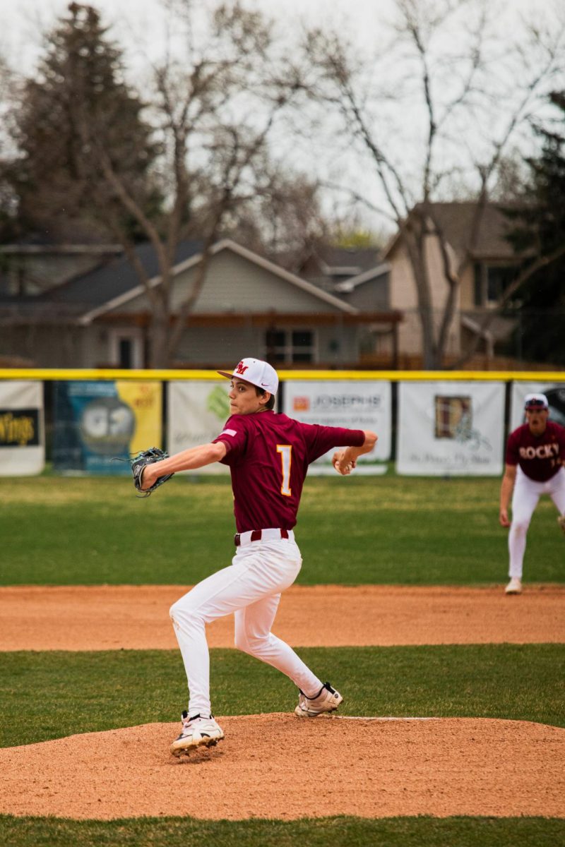 Freshman Kallen Wagner pitches against Greeley West in March. The Lobos won 14-4. 